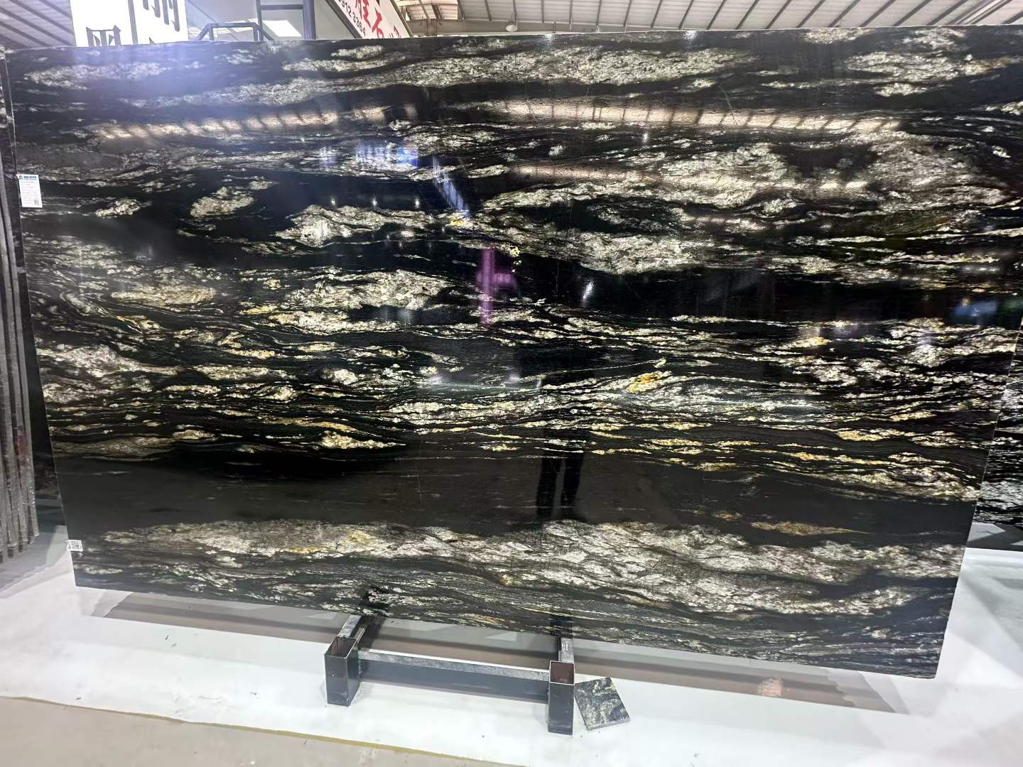 Polished Black granite with gold veins Polished Black granite with gold veins